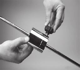 Gripping the String While holding the tension bar slightly above horizontal, wrap the free string clockwise around the gripper drum once and position between the gripper jaw.