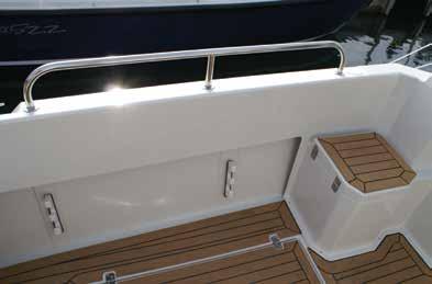helm console with privacy curtain Teak & ebony laminate flooring with non slip surface fitted to cabin & wheelhouse sole Light Oak faced cabin table & double berth conversion with infill cushion