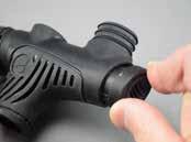 Place the oral inflator button (35) directly over the spring, and rotate the button as needed to align the