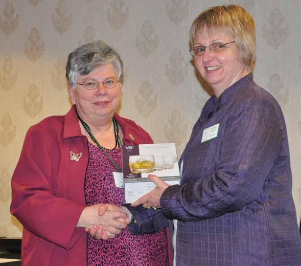 FEAtuRES Lynda McCuaig rewarding profound DeDiCation By Nikki Kross Shonna Ward (right) makes a presentation to Lynda McCuaig in 2011 in honour of her 40 years of volunteerism with 4-H Ontario.