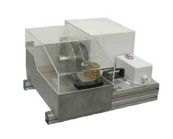TRIMMING SAW Bench top tool designed to cut preset core sample lengths. The preset sample lengths can be adjusted at any time by rearranging machined spacers to the desired length between the blades.