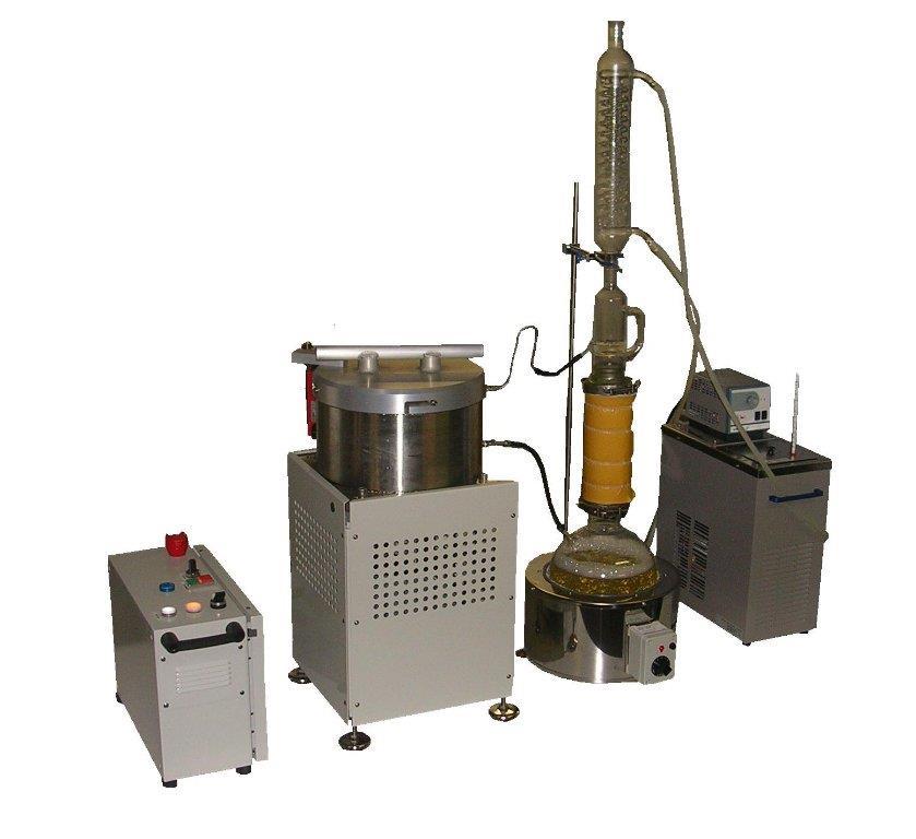 CENTRIFUGAL EXTRACTOR The centrifugal extractor is designed to spray warm, clean solvent from a still against the core samples.