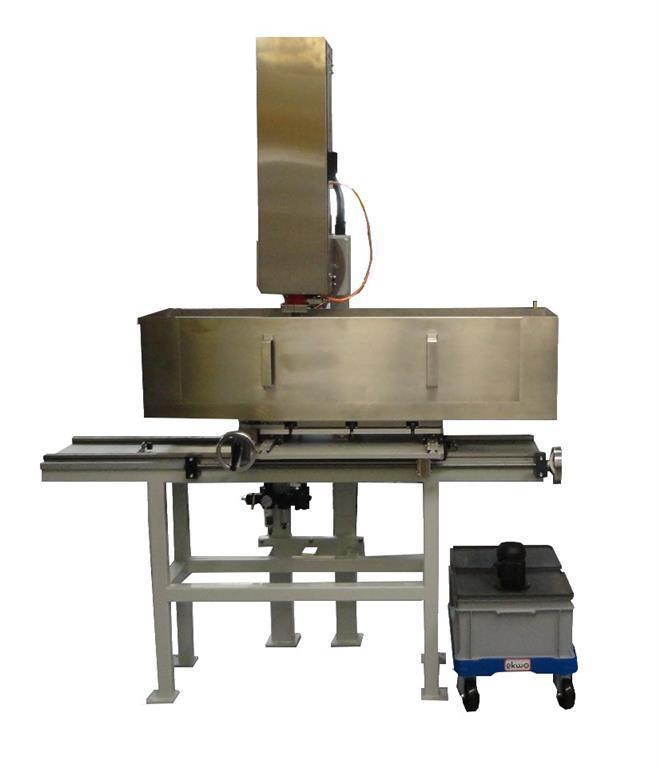 AUTOMATED PLUGGING MACHINE The heavy built diamond tooled drill press is especially designed to drill in various size core samples with an automatic, variable force, constant pressure feed.