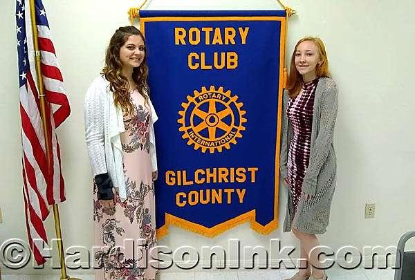 Gilchrist County Rotarians welcome future Interact Club members Alexis Haynes (left) and Hailey O Steen, both who will be juniors next year at Trenton High School, pose next to the Gilchrist Rotary