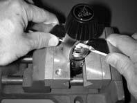 Pass a Breaker Bar (PN 20-157-500) through the yoke, and tighten the yoke screw lightly snug over the dimpled feature (see Fig. 2).