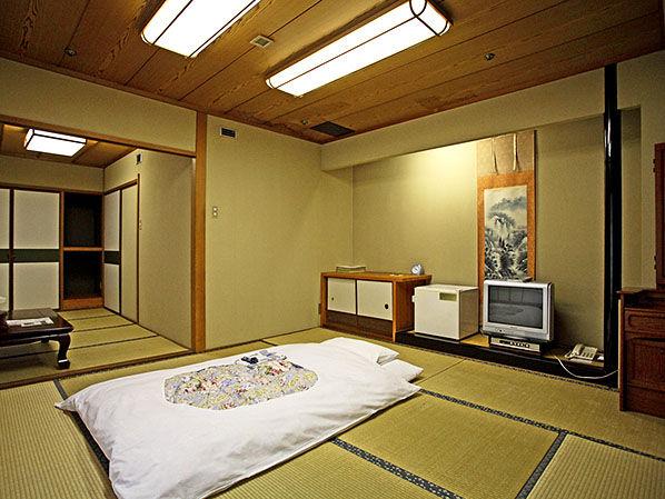Room in Ryokan Yukata Onsen hot spring Washing space Traditional Japanese room does not have bed, instead, it