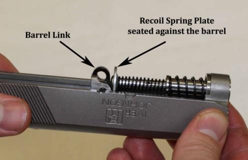 the recoil spring assembly is level with the slide, (Figure K). 2.