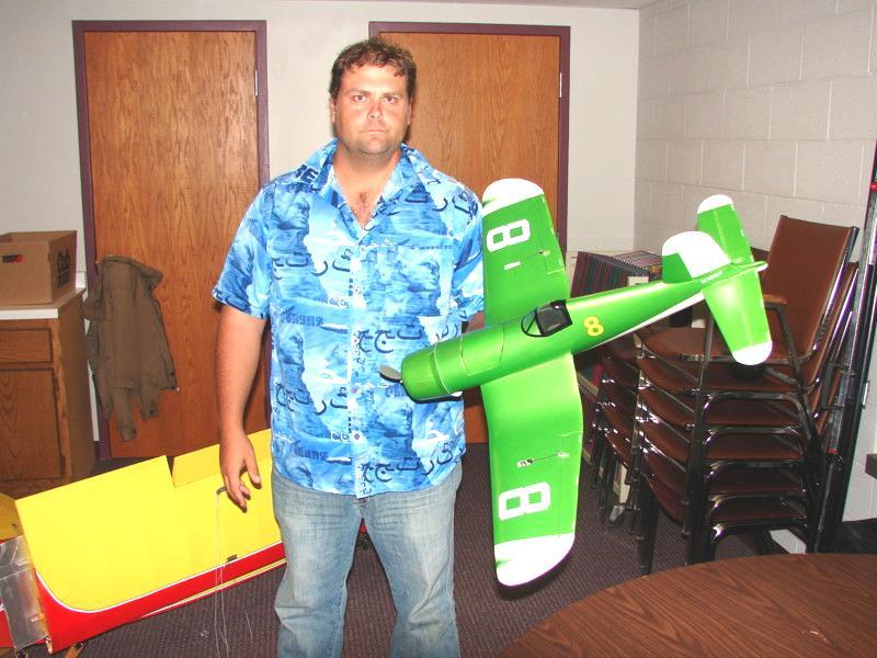 He embedded the servos in the wings and put a light green color on the plane with white trim. The underside of the wing was white with gray invasion stripes.