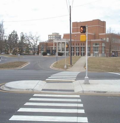 FIGURE 10: PEDESTRIAN REFUGE ISLAND AT INTERSECTION (SOURCE: FHWA) Advantages Reduces pedestrians crossing distance May reduce vehicle operating speeds Allows the pedestrian to cross the street in