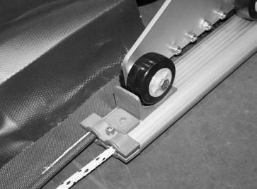 Run the key switch in the uncover position to roll the cover up on the roll-up tube.