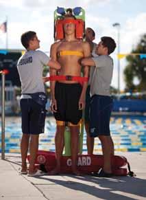 If this not possible, have another lifeguard provide manual stabilization from
