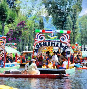 XOCHIMILCO BOAT TOUR Take a relaxing Flower-Decked Punt Ride, piloted by a local boatman