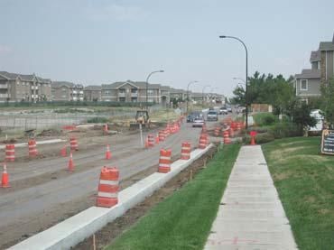 exceeds the 6-lane roadway capacity but the City s policy restricts arterial street cross-sections to six lanes, thus the bridge width over I-25 handles the six lane cross section with dual left