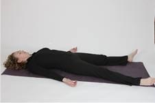 P.13 Savasana. When instructed slowly roll down onto your back. Extend your legs and place your hands beside your hips with the palms of your hands facing up ().