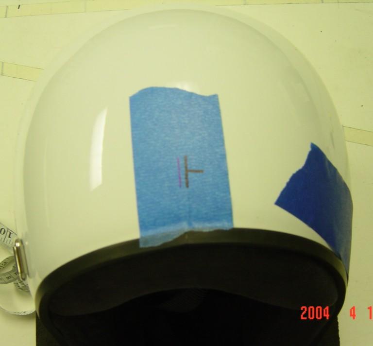 3) Measure from the helmet visor screw to the marked centerline on the right side of the helmet.
