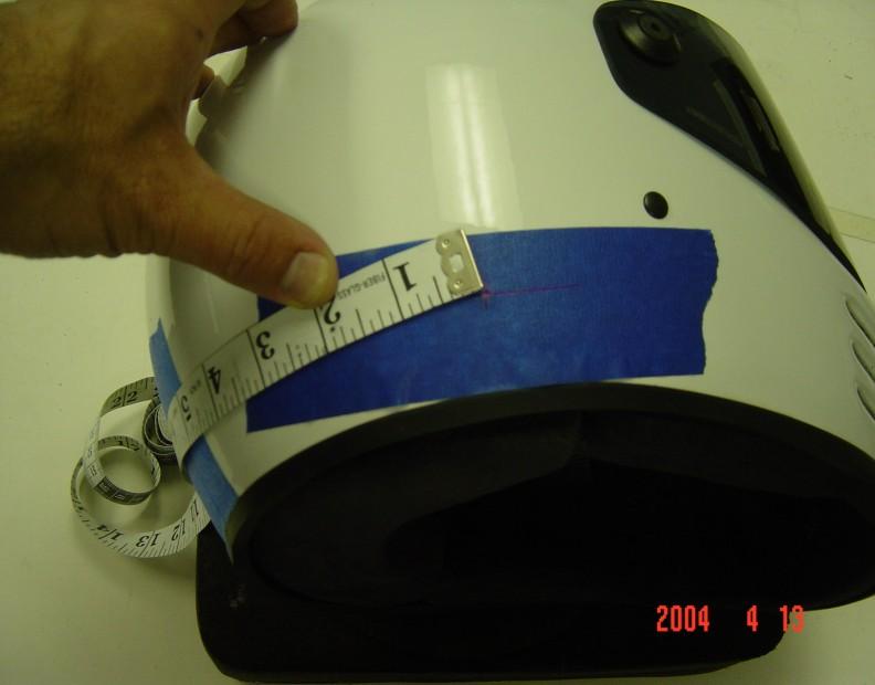 5 above the bottom ridge of the helmet. 4) You should have two marks on the tape on the back of the helmet.