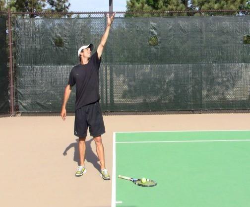 The Release The Ball Near Head Level Drill Start in the platform stance with a racquet Make the first move with a shoulder turn Release the ball at head level Keep the racquet hand lower than the