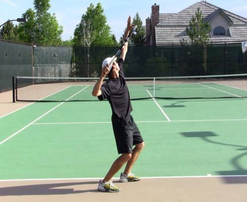 The Trophy Position Hold: Shadow Swing Drill Start in the platform stance with a racquet Make the first move by leading with the shoulders Move the tossing arm up faster than the serving arm Extend