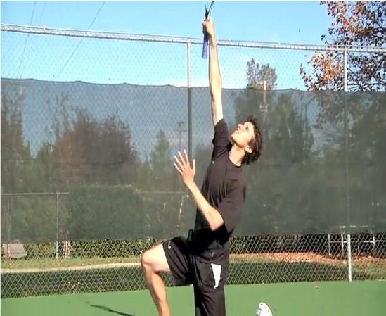 topspin serve swing Hit the ball as high as possible, stopping the follow-through at contact Hold