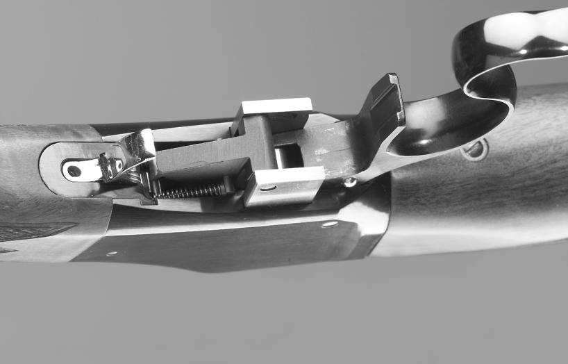 F IGURE 2C Lever in downward position (underside view) Trigger Trigger Adjustment screw Bottom of breech block Lever INITIAL CLEANING Before the first