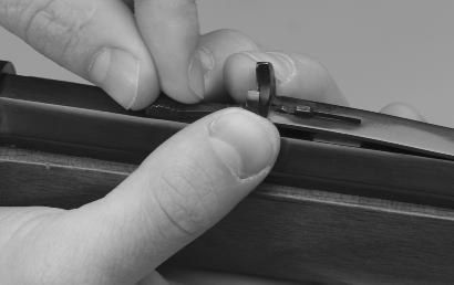 F IGURE 14 Lift up on the notch holder and move the elevator forward or rearward with your fingers. SIGHT ADJUSTMENTS Model 1892 rifles are fitted with traditional open sights.