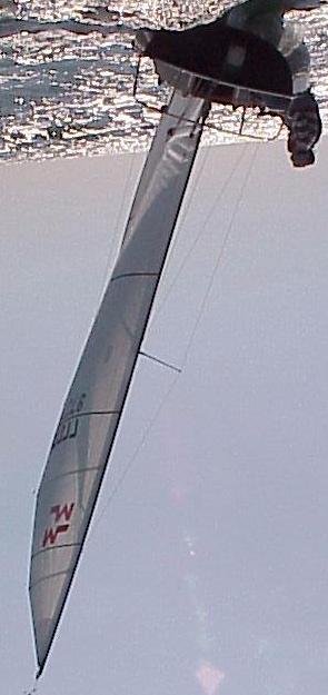 < The trim on the left is in ultra light air (less than 3 knots), boom on centerline with almost maximum traveller up and then having a fairly eased mainsheet to twist the leech to avoid stalling.