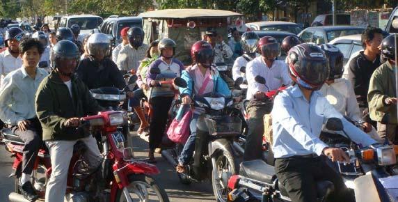 Picture 1: Motorbike riders with helmets during the first week of helmet enforcement in Jan.