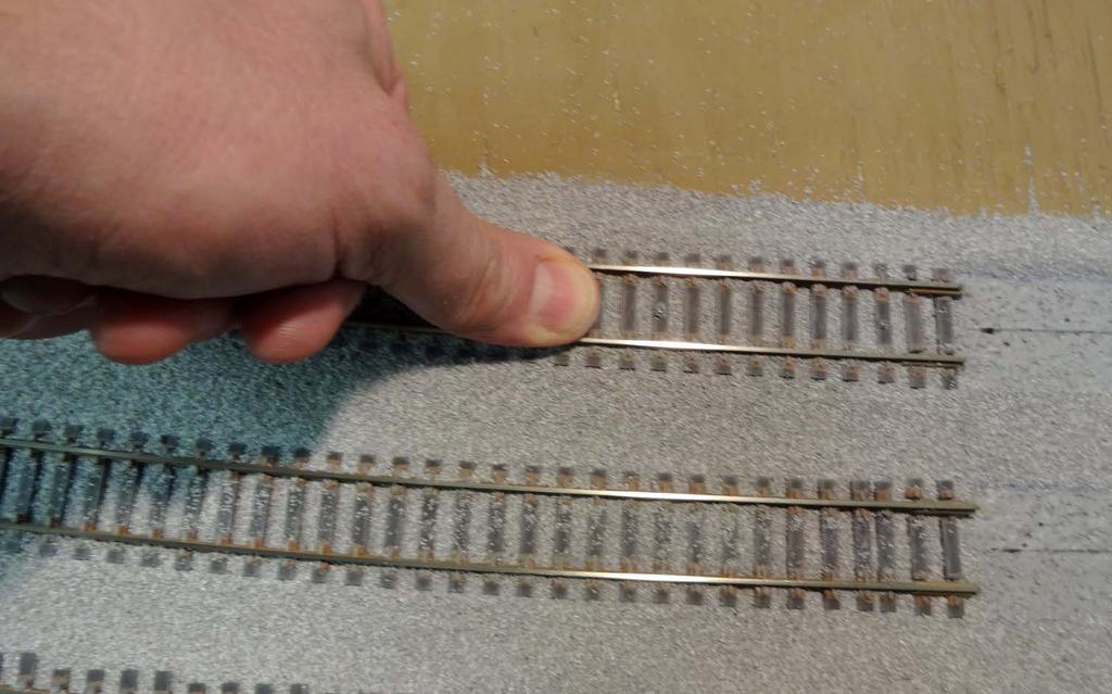 Ballasting Track Now run your thumb down the center of each