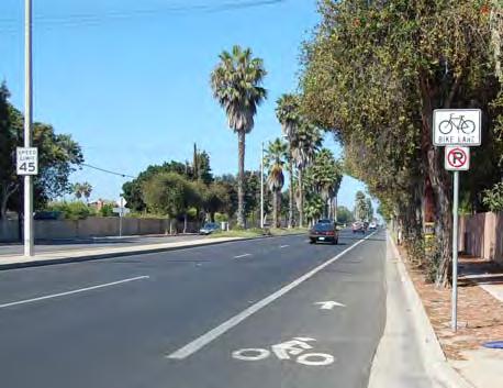 between passing vehicles, parked vehicles and bicyclists. Wide bicycle lanes are also appropriate in areas with high bicycle use.