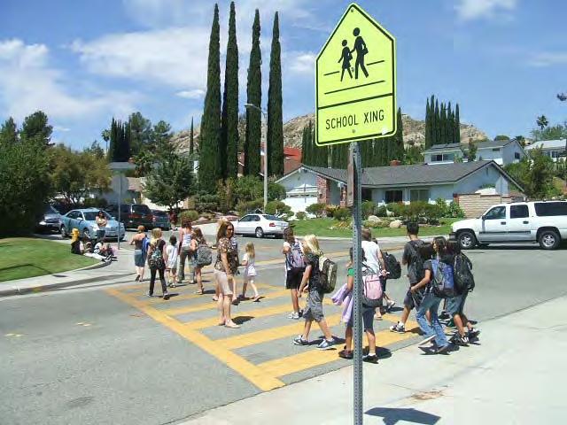School area signage and striping alerts motorists to be watchful for students, who because of