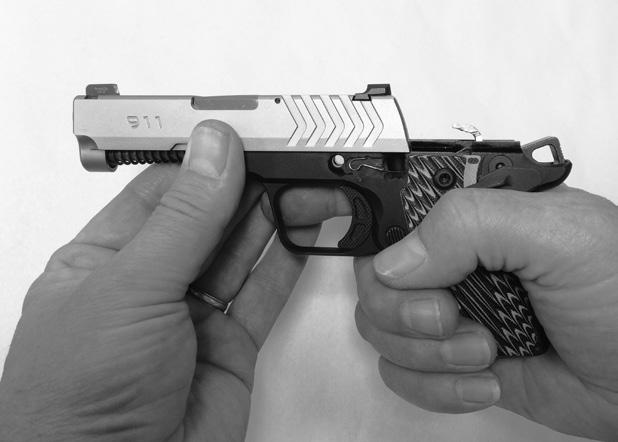 Move the complete slide assembly forward and off the frame (See Figure 24-2). DO NOT OVER ROTATE THUMB SAFETY WHEN SLIDE IS REMOVED.
