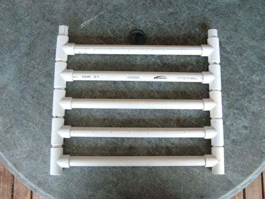 (2) glue middle of pvc t fittings onto ends of 16 inch pvc pipes; these form a rung in the collector frame ladder. There will be five of these.