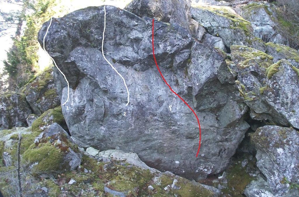 In the following pictures the white routes are established problems and the red lines are potential problems rated approximately V5 and up. Middle Earth Boulder 1.