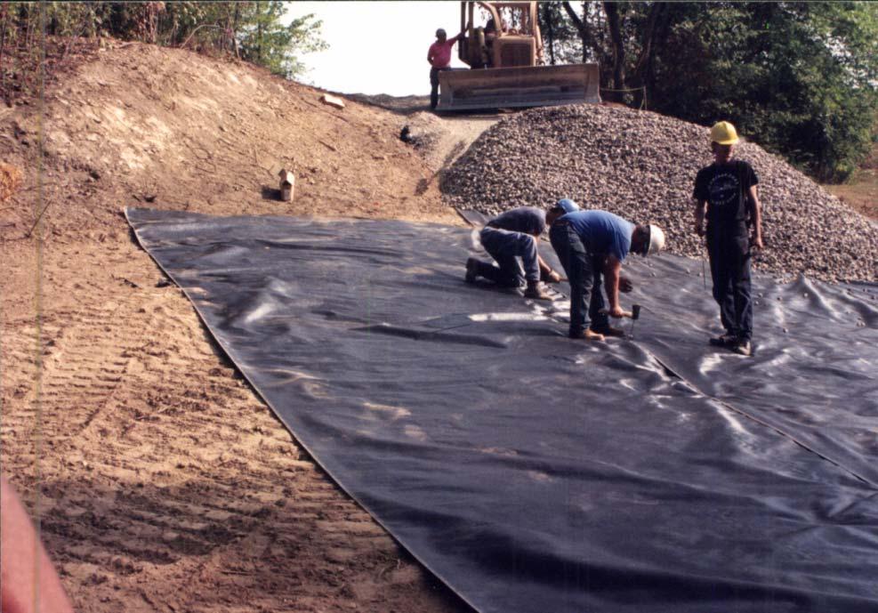 This is a photograph of a geo textile filter fabric being placed before gravel