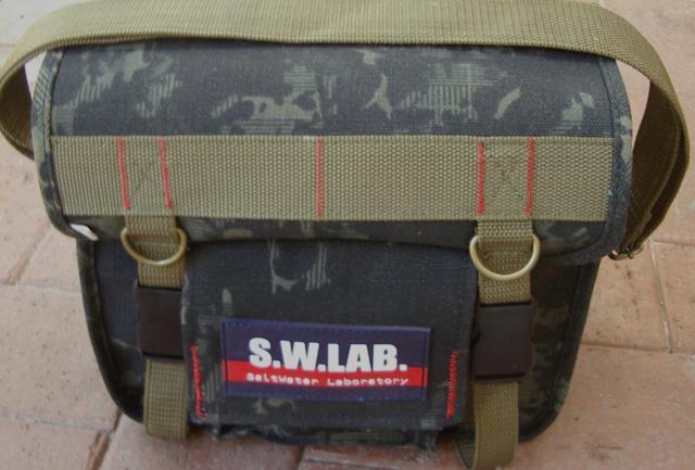 Tackle Secured by 2 buckles fastened cover flap Covering an extra pouch on the