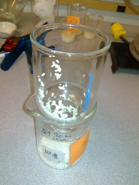 Then, remove the clip that holds the 2-piece filter and place top portion of the 2-piece filter (holder) over the beaker.