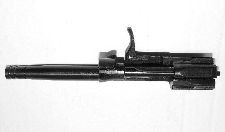 Once the back of the bolt carrier contacts the backplate of the receiver. Lift the rear portion of the bolt carrier and remove it and the bolt from the receiver. (See Illustration #12.) 7.