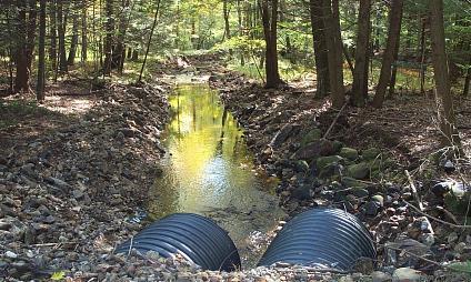 Improper culvert installation blocks and prevents upstream passage for the wild brook trout population. B.