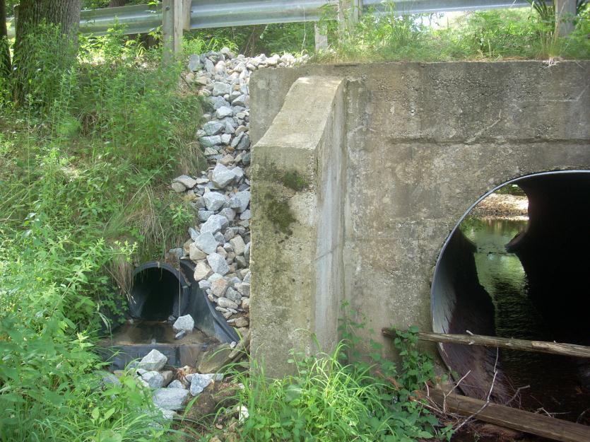 25 Figure 12: The tail end of a pipe that directs stormwater runoff into Dudley Brook. The amount of impervious surface is increasing rapidly in the Lamprey River watershed.