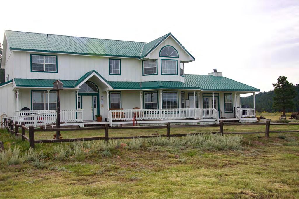 Beautiful Ranch House, Barn, Bunkhouse, and old log cabin A beautiful ranch house with a full-length west-facing porch that overlooks the property was built in 2000.