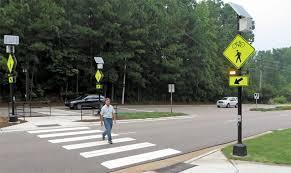 Methods: Staged Pedestrian Crossings Pedestrian indicated intention to cross by standing at the curb or roadway edge with one foot in crosswalk while facing oncoming traffic Pedestrian
