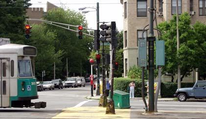 Pedestrian walk signals are present at all four corners of the intersection and at the median on Commonwealth Avenue. The pedestrian signals seem to function in an appropriate manner.