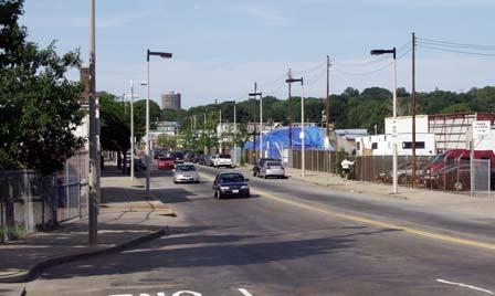 The avenue lies between a residential neighborhood to the east and the station to the west.