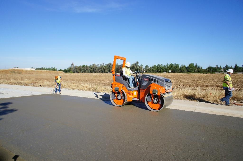 Definition Roller-Compacted Concrete (RCC) is a no-slump concrete that is compacted by vibratory rollers Zero slump (consistency of damp dense gravel) No forms or finishing No