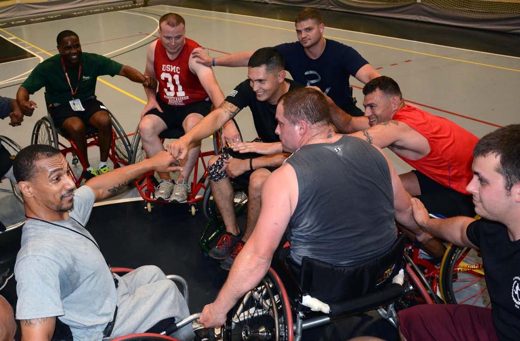 CUTLINE: Coach Jermell Pennie fires up his military pupils during wheelchair basketball training in preparation for the 2014 U.S. Army Warrior Trials wheelchair basketball competition.