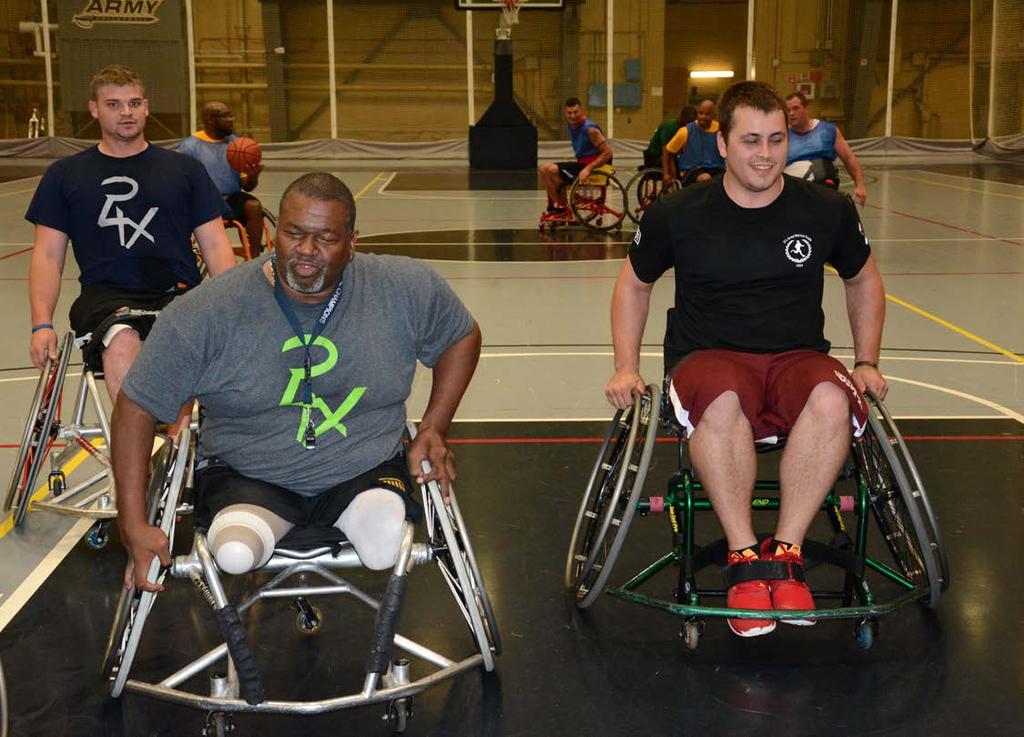 CUTLINE: From left, Coaches Joey Gugliota and Lee Montgomery share chair-handling tips with Fort Stewart Soldier, front center Private 1st Class Kevin Szortyka.