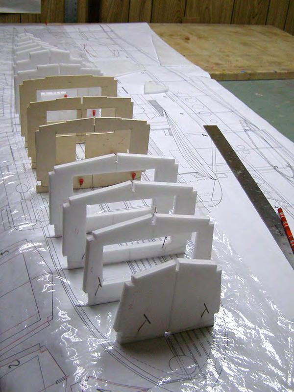 The plywood doublers are glued to the hull sides and the fuselage bulkheads are