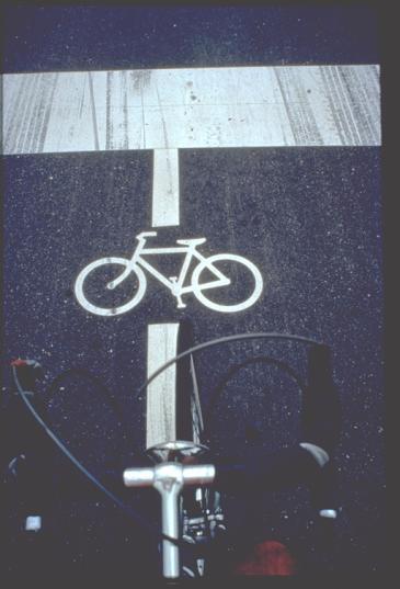Figure 18 shows a Shared Lane Marking (or sharrow ), now approved in the MUTCD. Urbana is one of the Illinois cities using these.