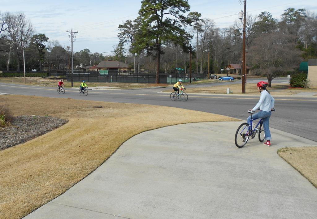 APPENDIX A: BICYCLE AND PEDESTRIAN TOOLKIT Sidepaths (Intersections and Driveways) Sidepaths are preferred by many less experienced riders who desire facilities that are physically separated from
