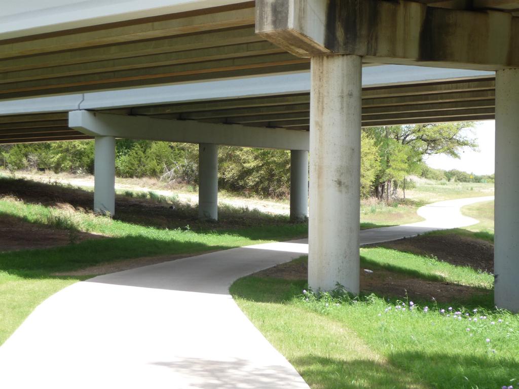 The bottom span enclosed, the underpass width should be at least 14 feet in width, and in some cases wider if the underpass exceeds 100 feet in length.